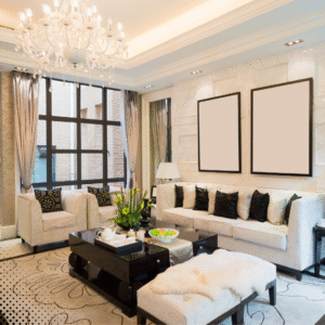 Elegant, well-lit living room with modern decor, white furniture, and a chandelier—example of a clean, inspection-ready home interior